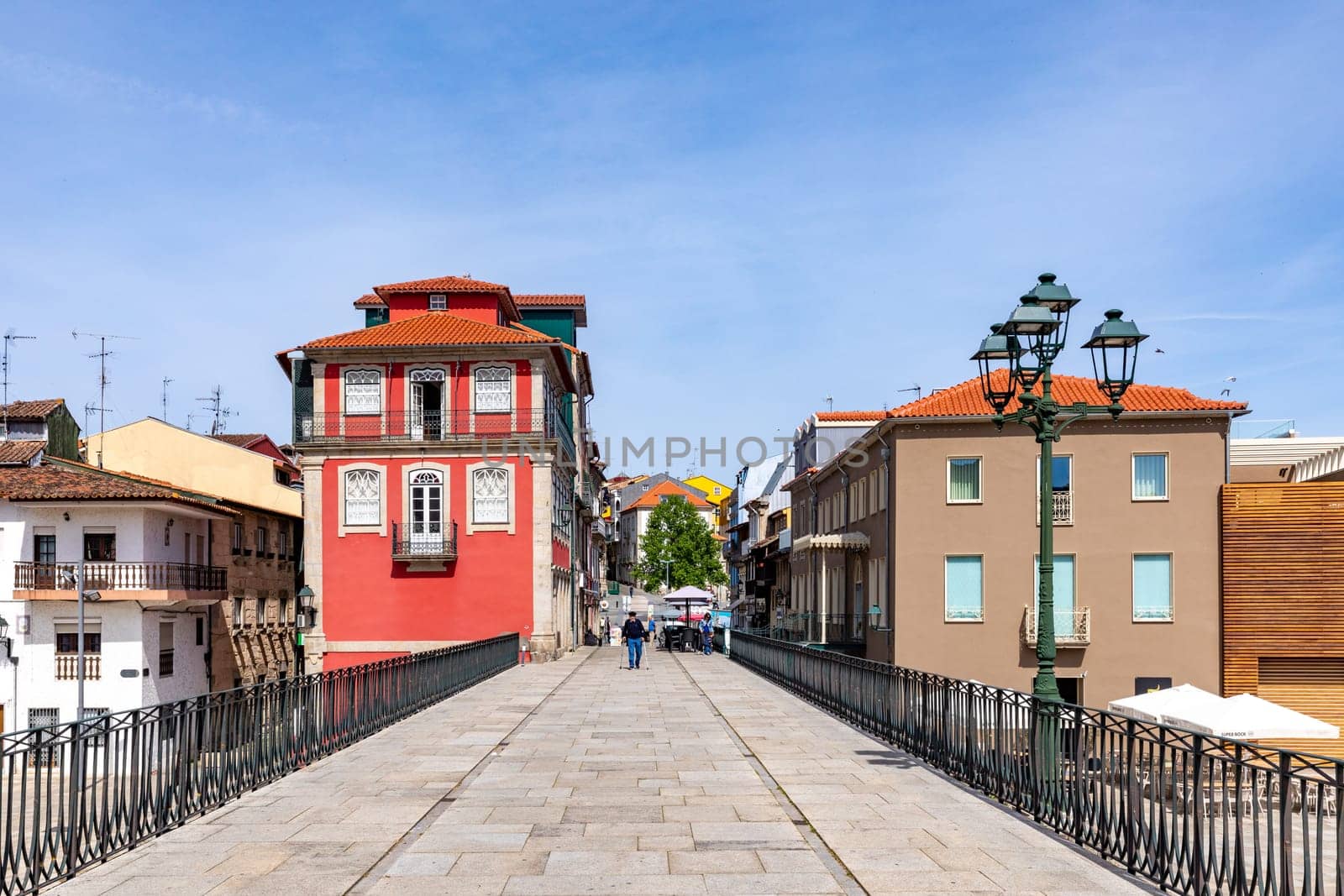 Chaves, Portugal - May 1, 2023: scenic narrow street in Chaves in early morning light with cobble stones and old historic houses.