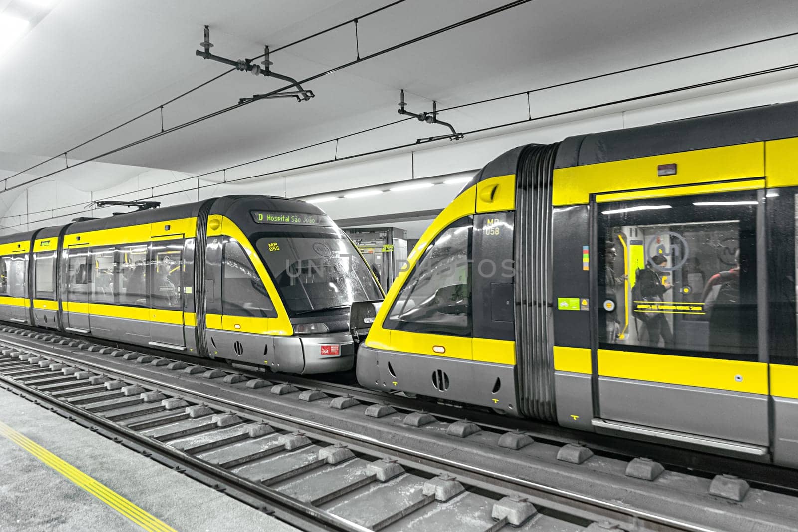 Porto, Portugal - May 3, 2023: metro stops at metro station faria guimaraes with modern metro in Porto, Portugal.