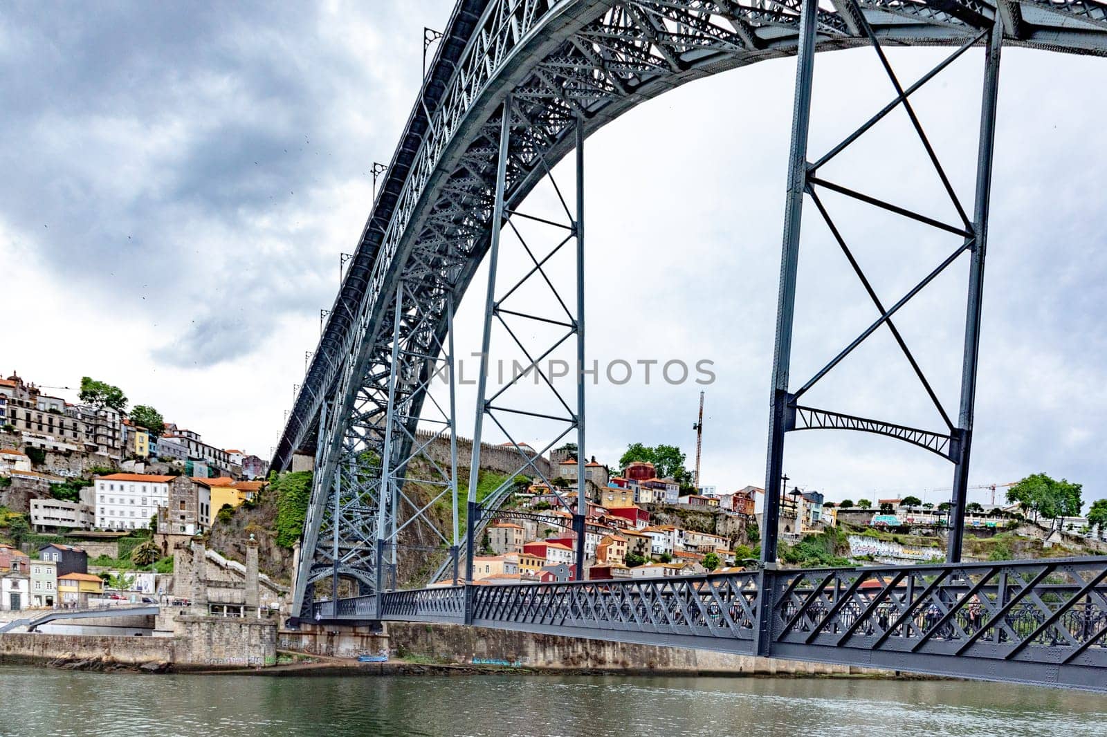 Porto, Portugal - May 3, 2023:view to old town of Porto with view through famous iron bridge Dom Luis I.