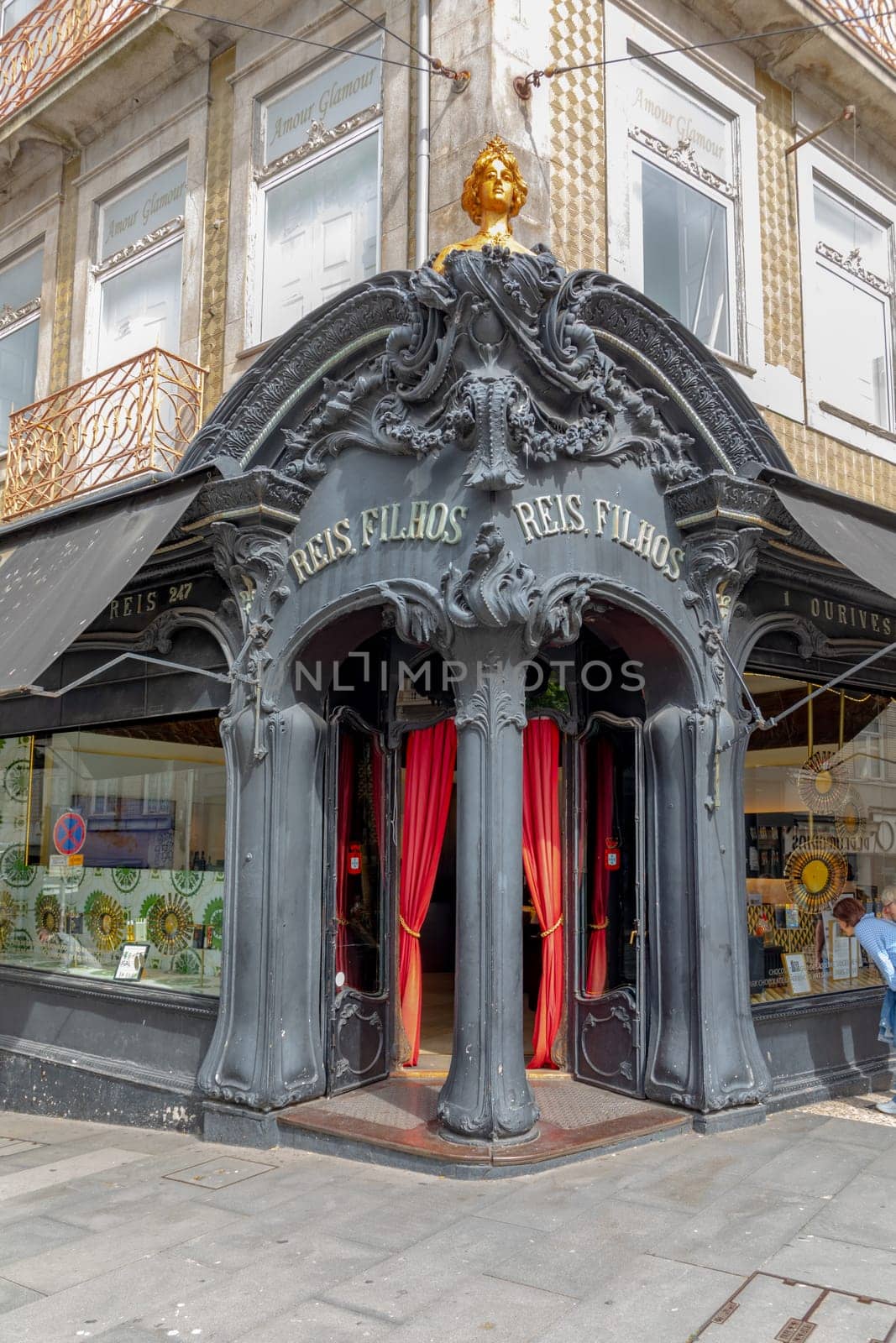 Porto, Portugal - May 3, 2023: view of the liberty decorated entrance of Reis Filhos, an historic shop in Porto
