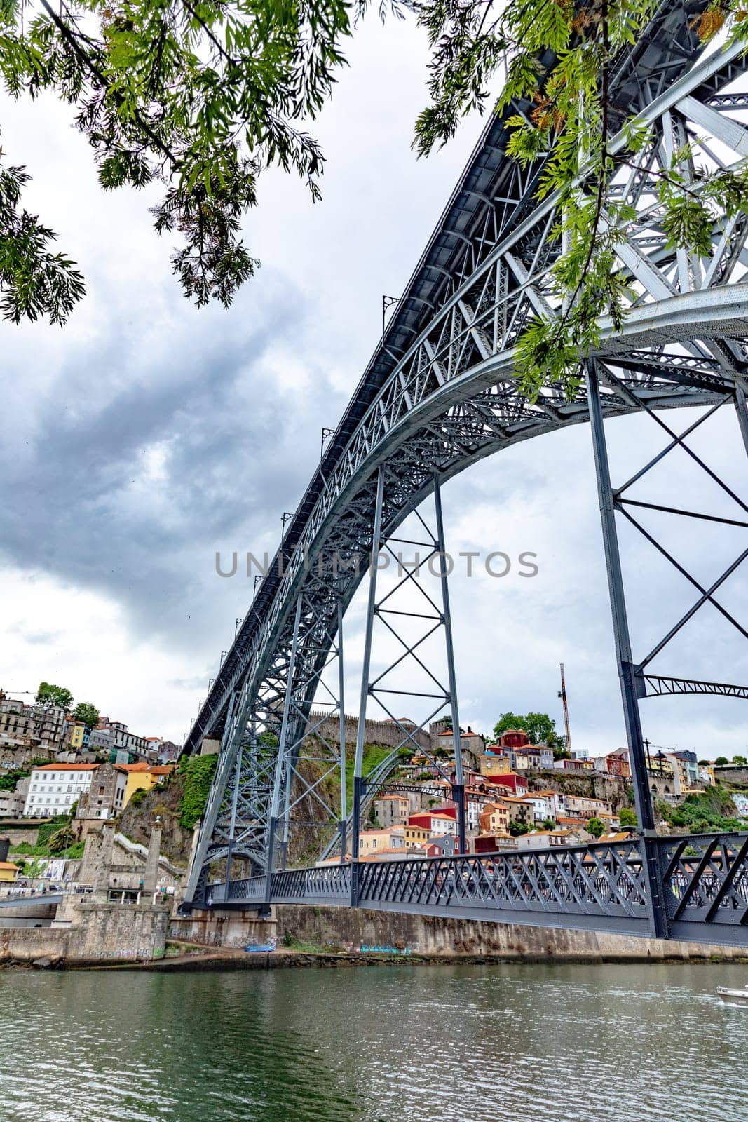 Porto, Portugal - May 3, 2023:view to old town of Porto with view through famous iron bridge Dom Luis I.