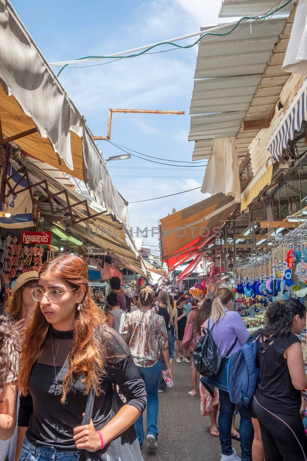 Tel Aviv, Israel - May 18, 2023 :Israeli people shopping at Carmel Market (Shuk HaCarmel) in Tel Aviv, Israel.It's a very popular marketplace in Tel Aviv sells mostly food and home accessories goods.