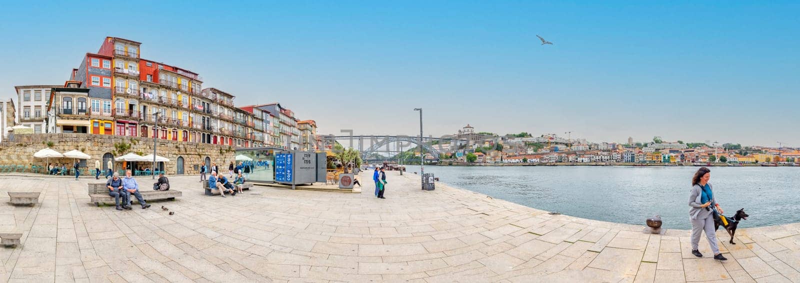Porto, Portugal - May 4, 2023: panoramic view to promenade of Porto, Bridge and promenade of Gaia.