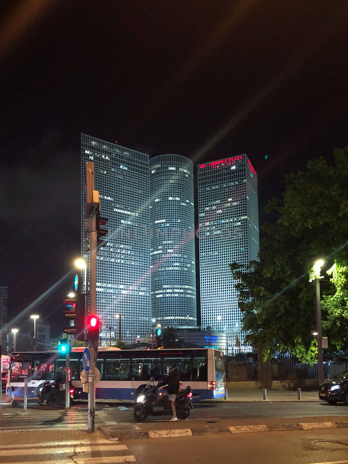Tel Aviv, Israel - May 18, 2023: The Crowne Plaza Tel Aviv City Center Hotel by night, located adjacent to the Azrieli Mall and the Ayalon highway, is one of two Crowne Plaza hotels in Tel Aviv, Israel.