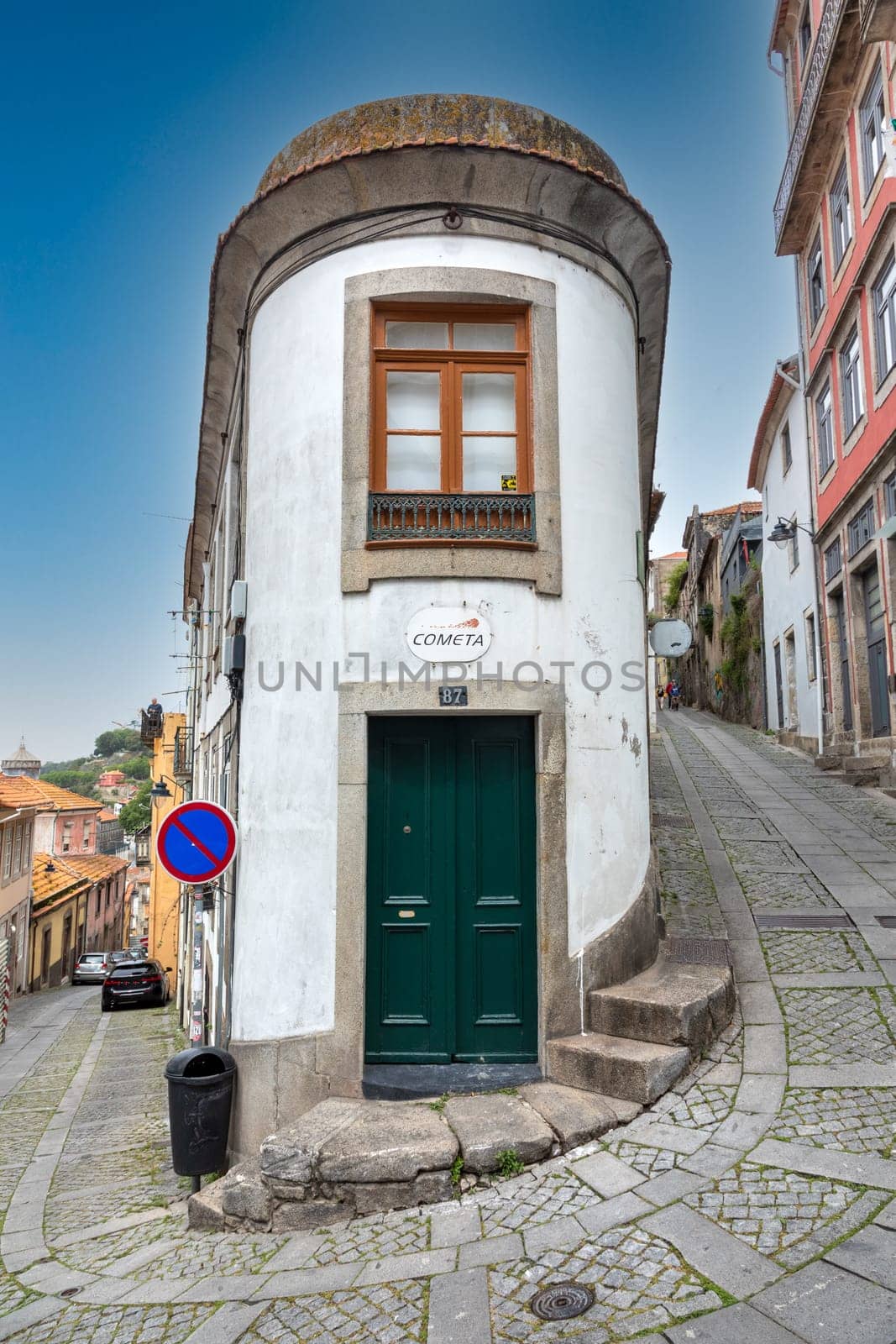 Porto, Portugal - May 4, 2023: small house in the old town of Porto with narrow roads.
