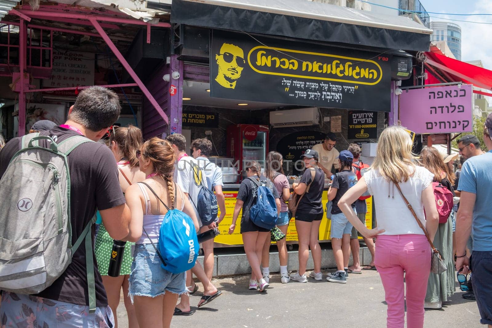 Tel Aviv, Israel - May 18, 2023 :Israeli people shopping at Carmel Market (Shuk HaCarmel) in Tel Aviv, Israel.It's a very popular marketplace in Tel Aviv sells mostly food and home accessories goods.