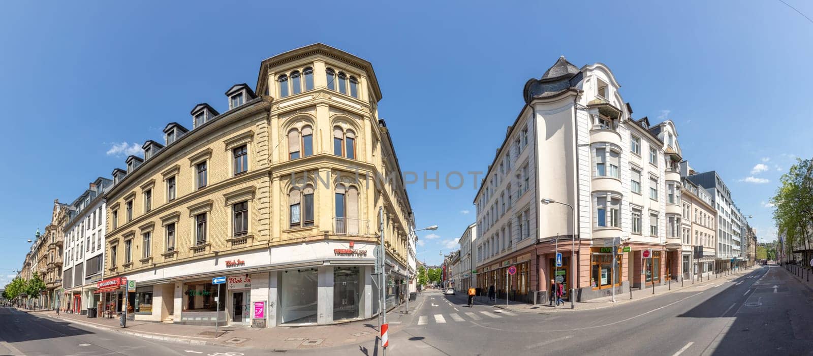 Wiesbaden, Germany - May 18, 2023: view to the old historic houses in the shopping street Friedrichstrasse in Wiesbaden with old facades..