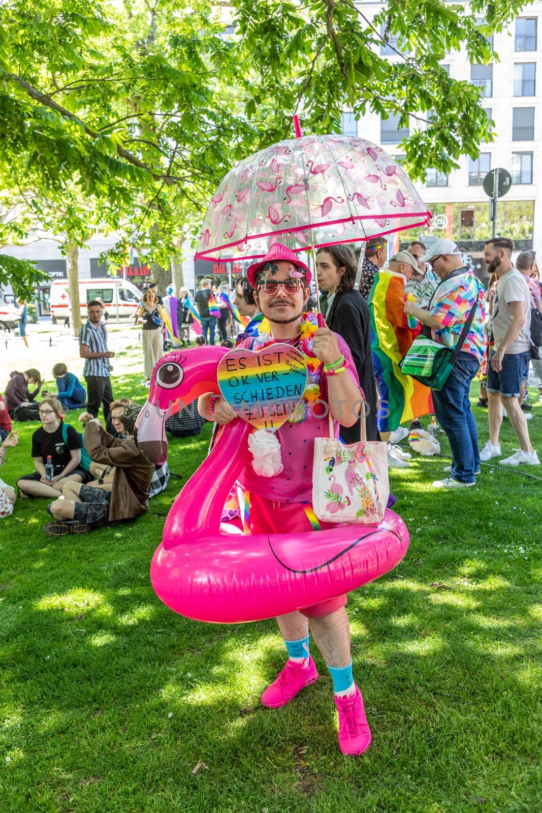 Wiesbaden, Germany - May 27, 2023: people enjoy the christopher street parade in Wiesbaden with rainbow flags and beaufiful costumes.