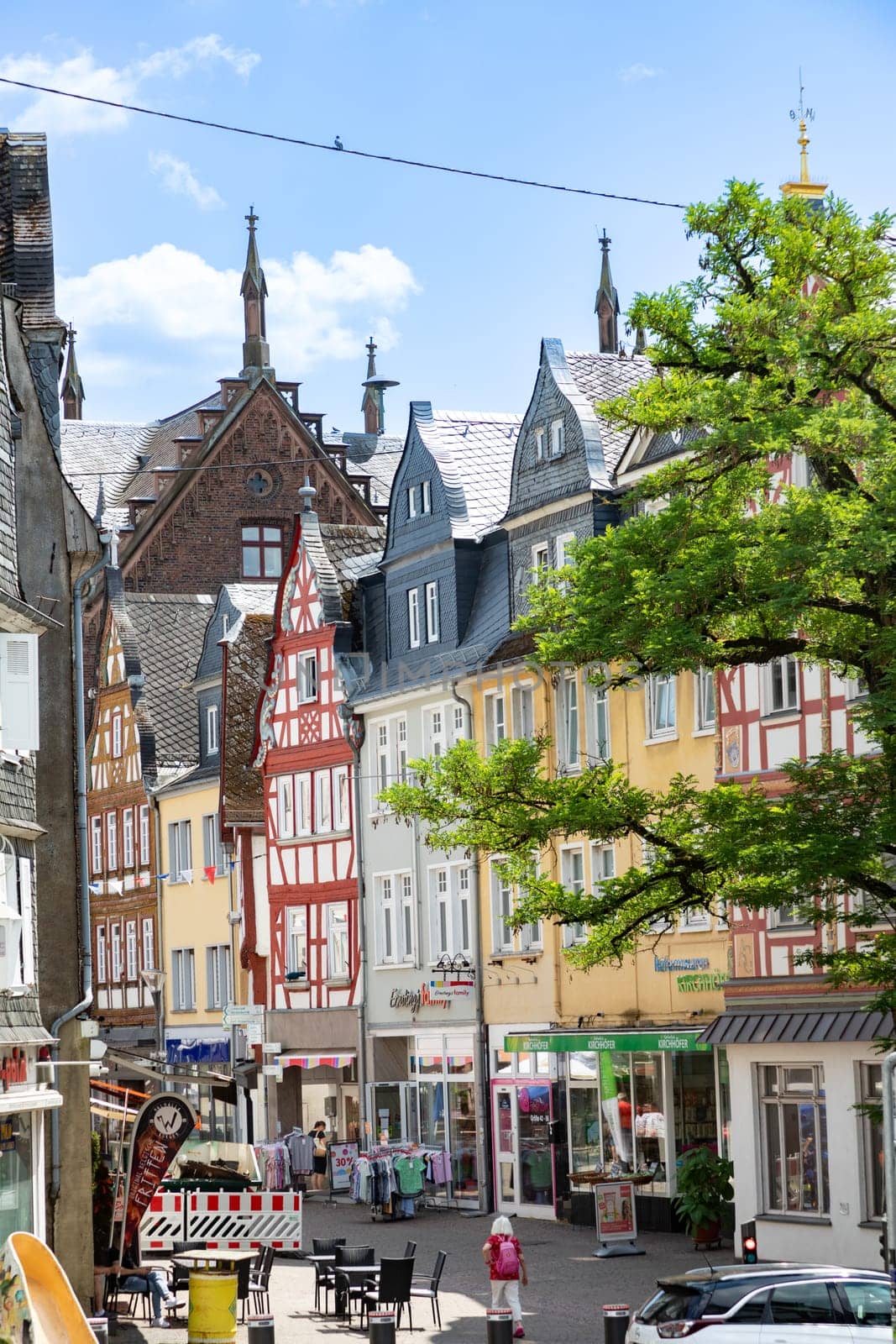 Montabaur, Germany - June 15, 2023: people enjoy visiting old town of Montabaur with lovingly restored half-timbered buildings from the 16th and 17th centuries.