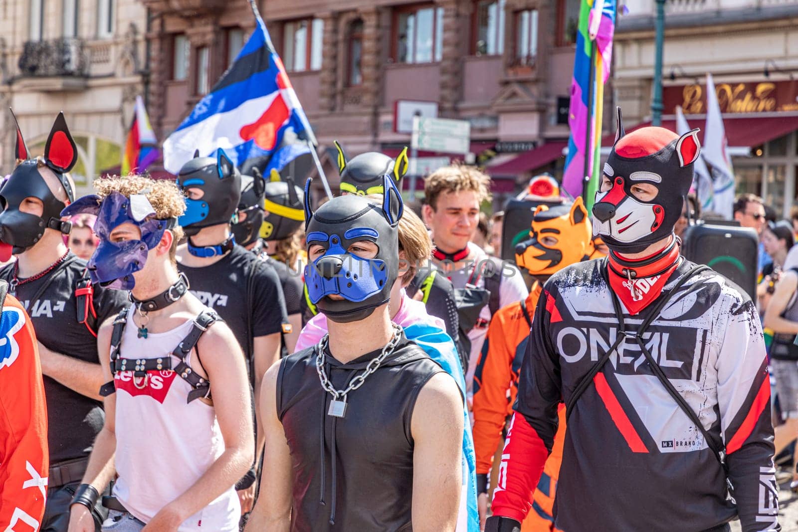 Wiesbaden, Germany - May 27, 2023: people enjoy the christopher street parade in Wiesbaden with rainbow flags and beaufiful costumes.