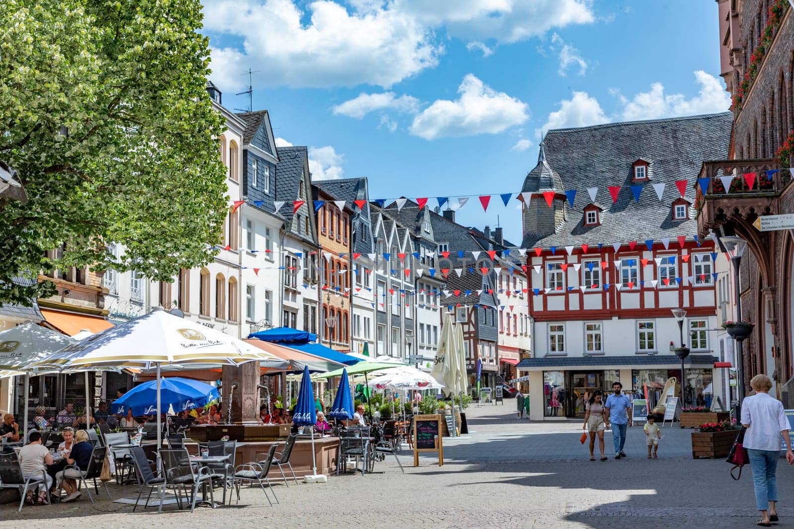 Montabaur, Germany - June 15, 2023: people enjoy visiting old town of Montabaur with lovingly restored half-timbered buildings from the 16th and 17th centuries.