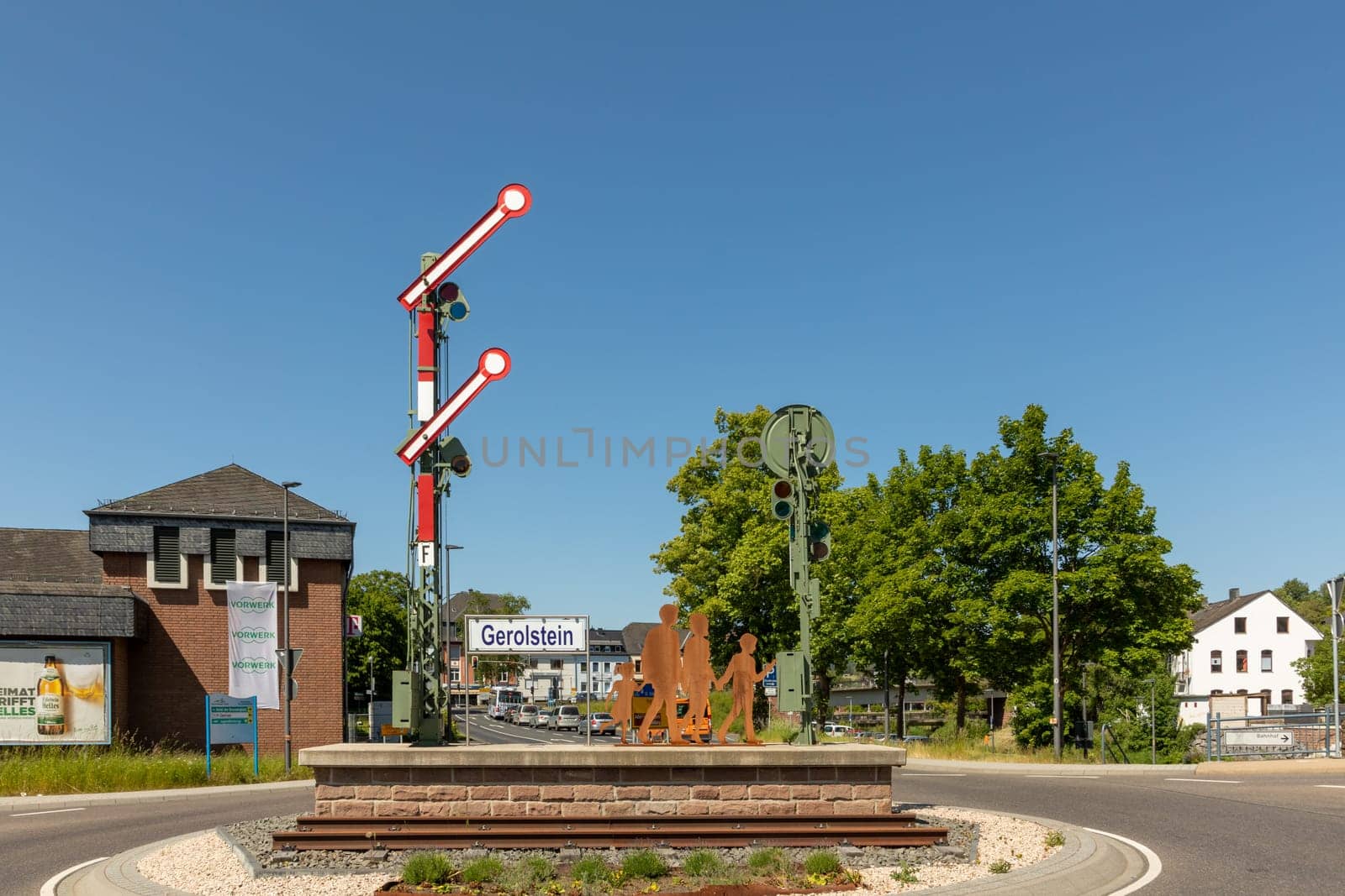 Gerolstein, Germany - June 4, 2023: the worker for the town Gerolstein have inplemented a sculpture by itself with a signal and iron plate symbolizing people.  Helmut Pawlak assistet the worker.