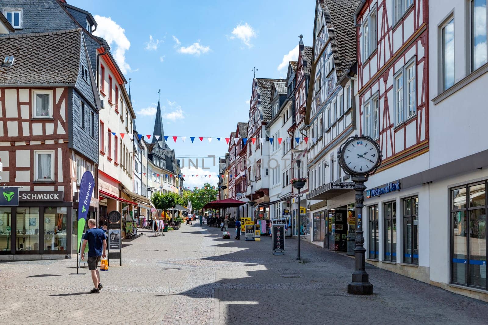 Montabaur, Germany - June 15, 2023: people enjoy visiting old town of Montabaur with lovingly restored half-timbered buildings from the 16th and 17th centuries.