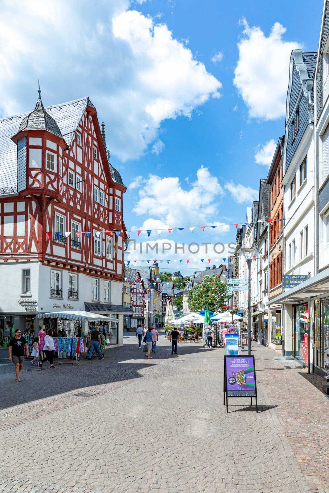 Montabaur, Germany - June 15, 2023: people enjoy visiting old town of Montabaur with lovingly restored half-timbered buildings from the 16th and 17th centuries.