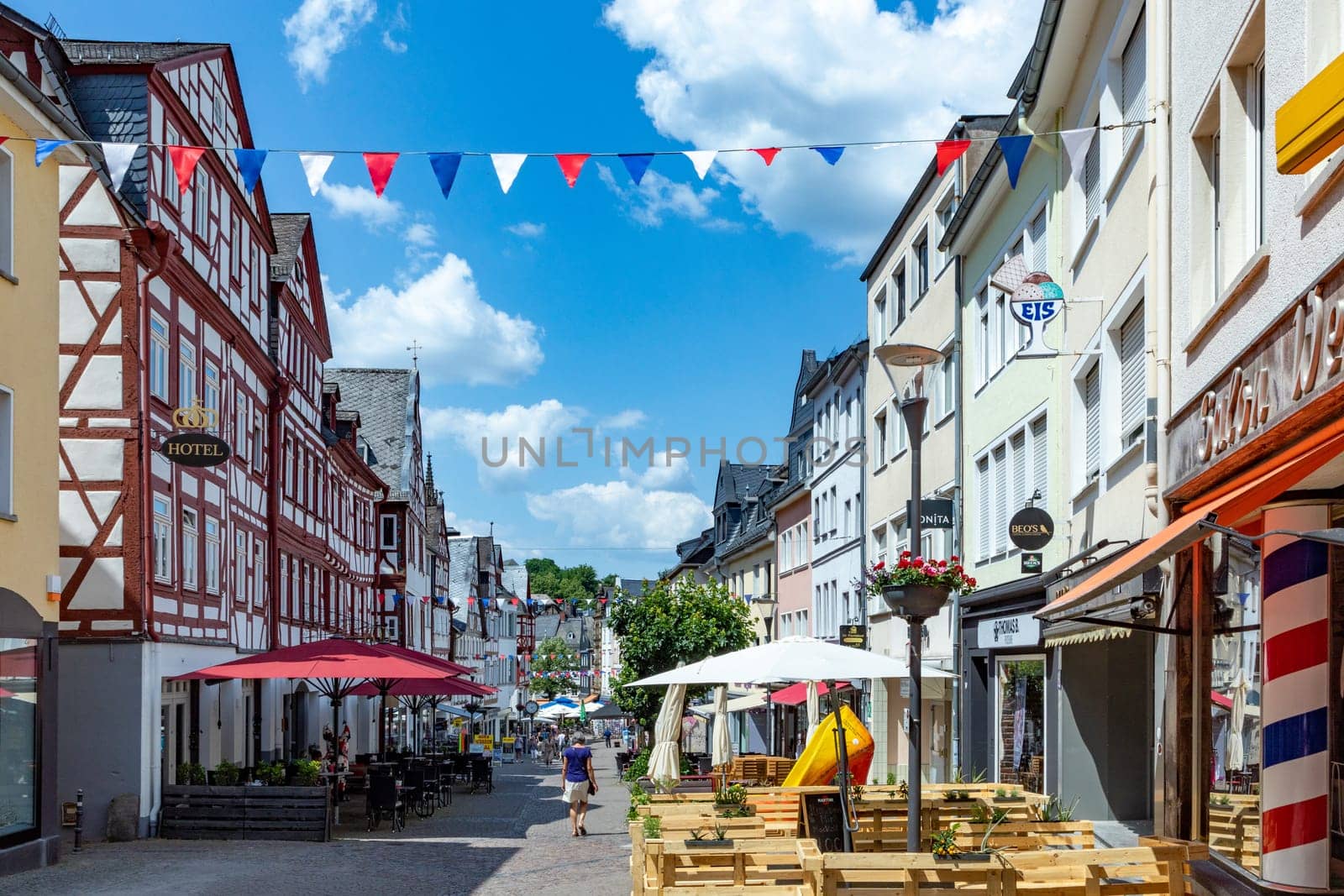Montabaur, Germany - June 15, 2023: people enjoy visiting old town of Montabaur with lovingly restored half-timbered buildings from the 16th and 17th centuries.