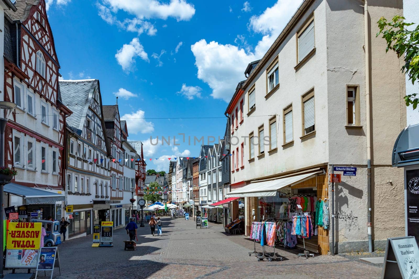 Montabaur, Germany - June 15, 2023: people enjoy visiting old town of Montabaur with lovingly restored half-timbered buildings from the 16th and 17th centuries.