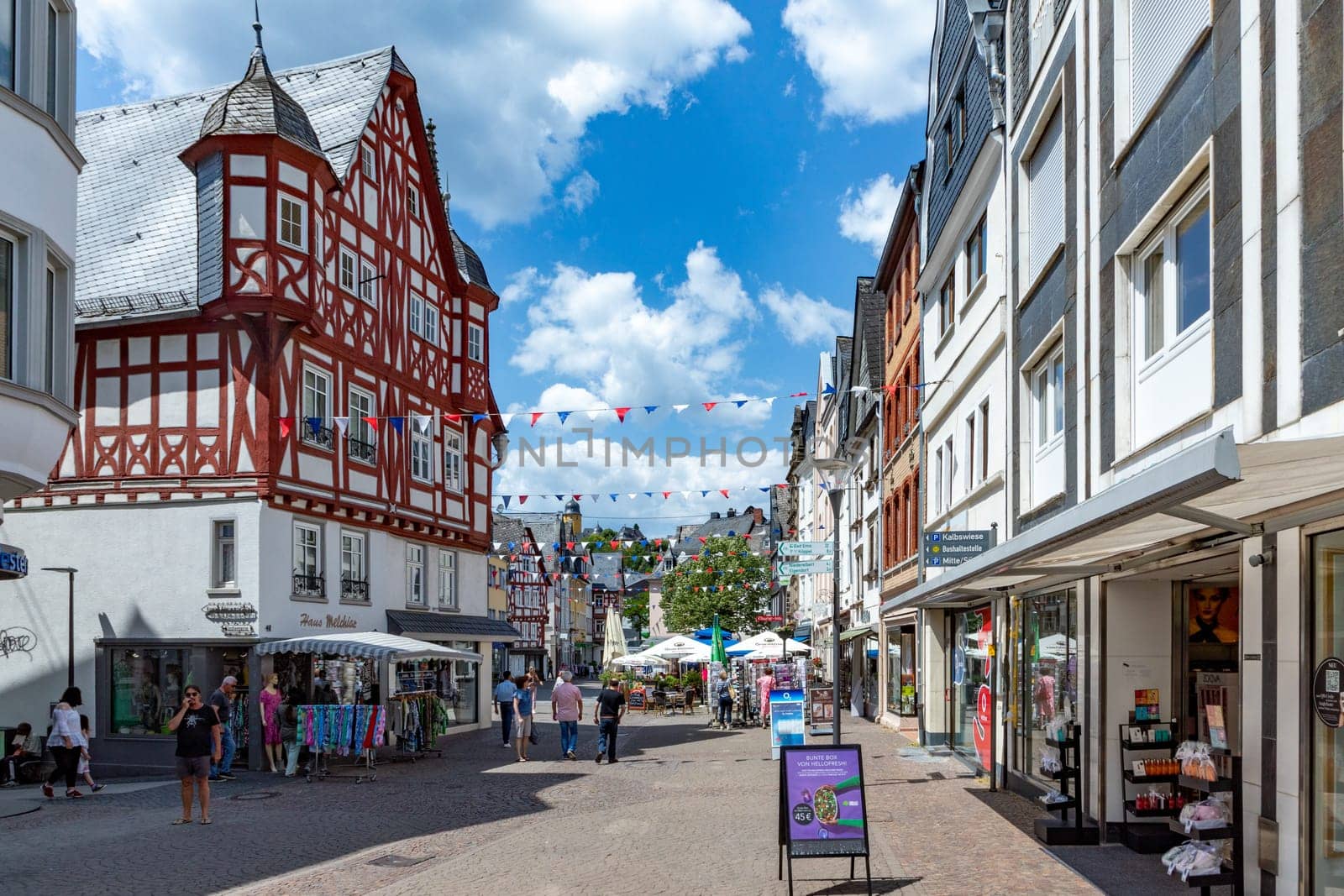 Montabaur, Germany - June 15, 2023: people enjoy visiting old town of Montabaur with lovingly restored half-timbered buildings from the 16th and 17th centuries.
