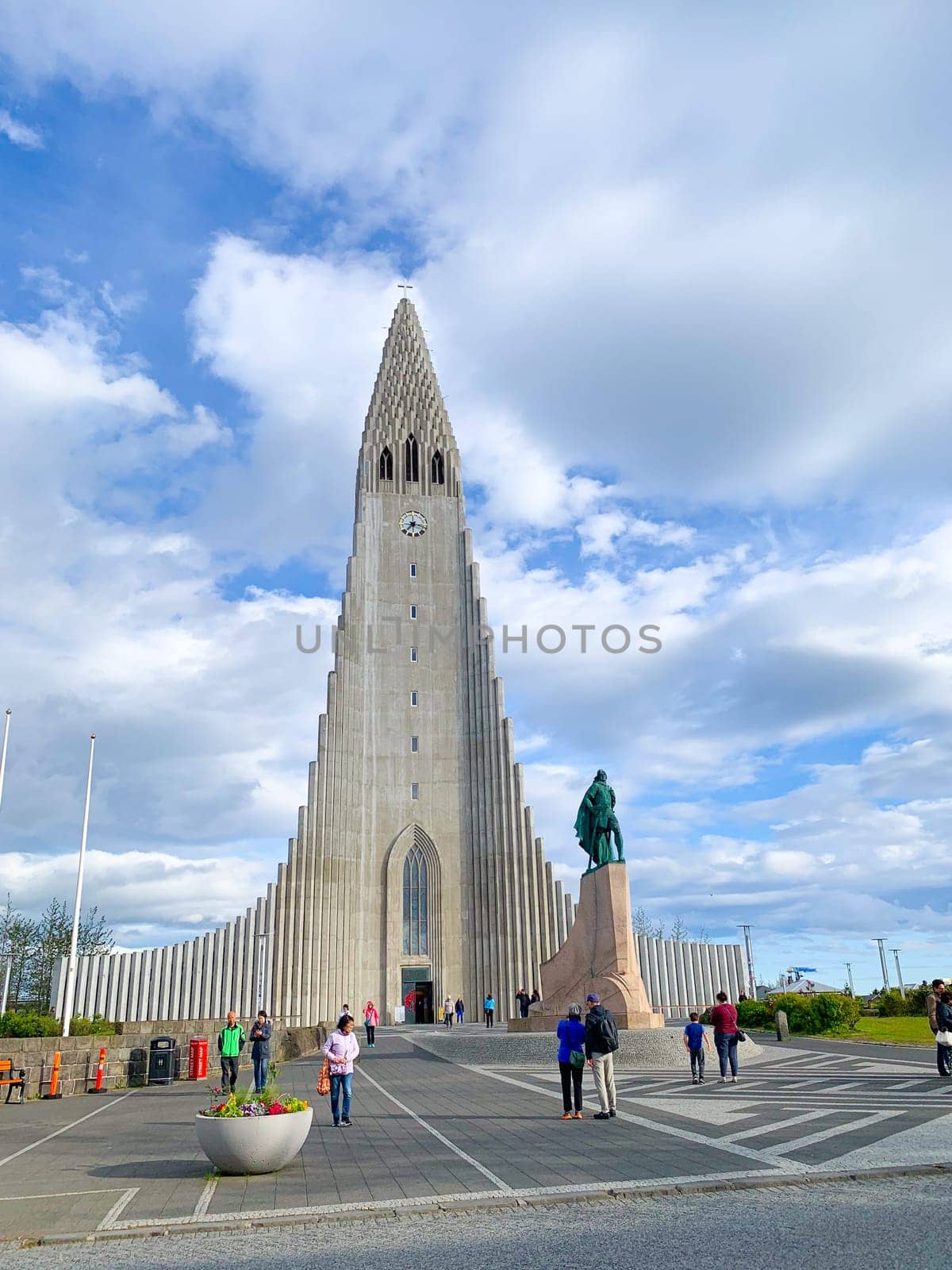 Reykjavík, Iceland - July 13, 2023: tourists visit modern Hallgrimskirkja church in the center of Reykjaivk, Iceland