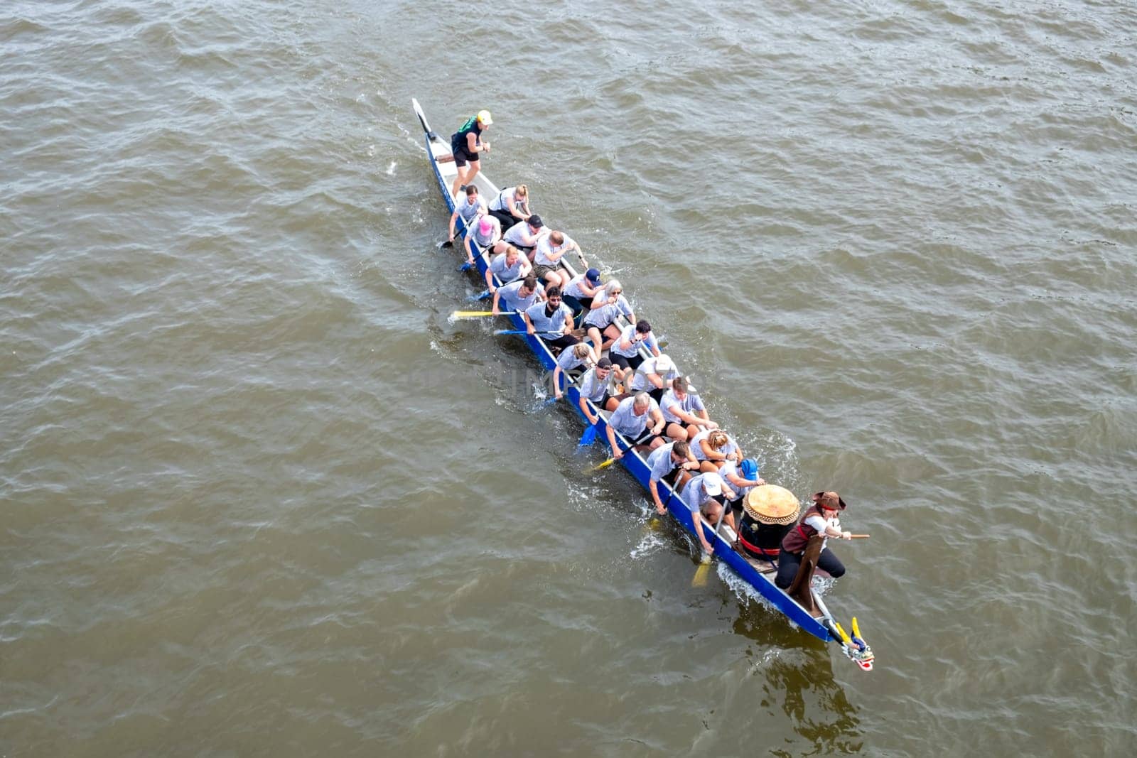 Frankfurt, Germany - August 26, 2023: people have fun visiting the Dragon boat race at the Museumsuferfest - engl: festival of the Museums at the river - in Frankfurt.