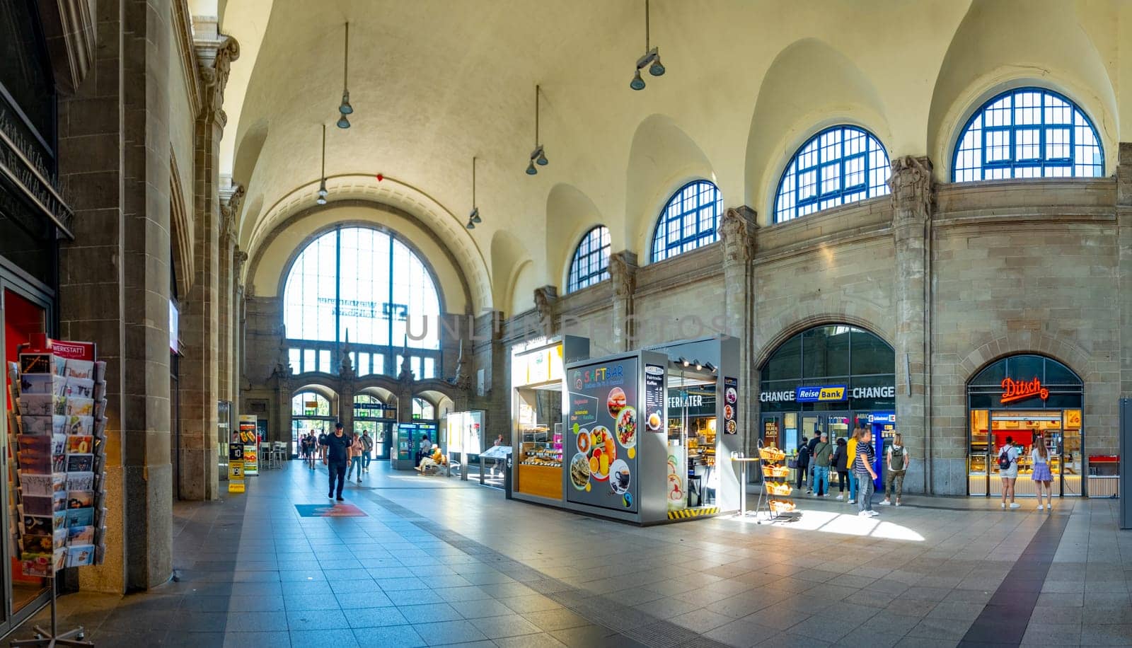 Frankfurt am Main, Germany - August 10, 2023: people at the central train station in Frankfurt hurry to the train.