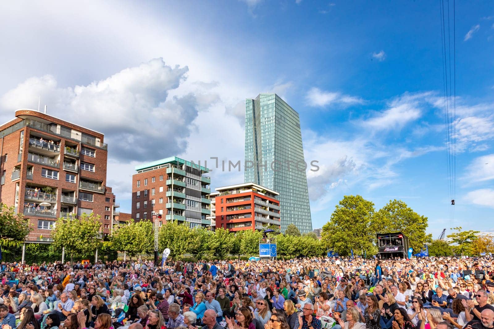 Frankfurt, Germany - August 31, 2023: people enjoy the open air festival with the HR synphony orchestra and big band at the Weseler werft in Frankfurt.