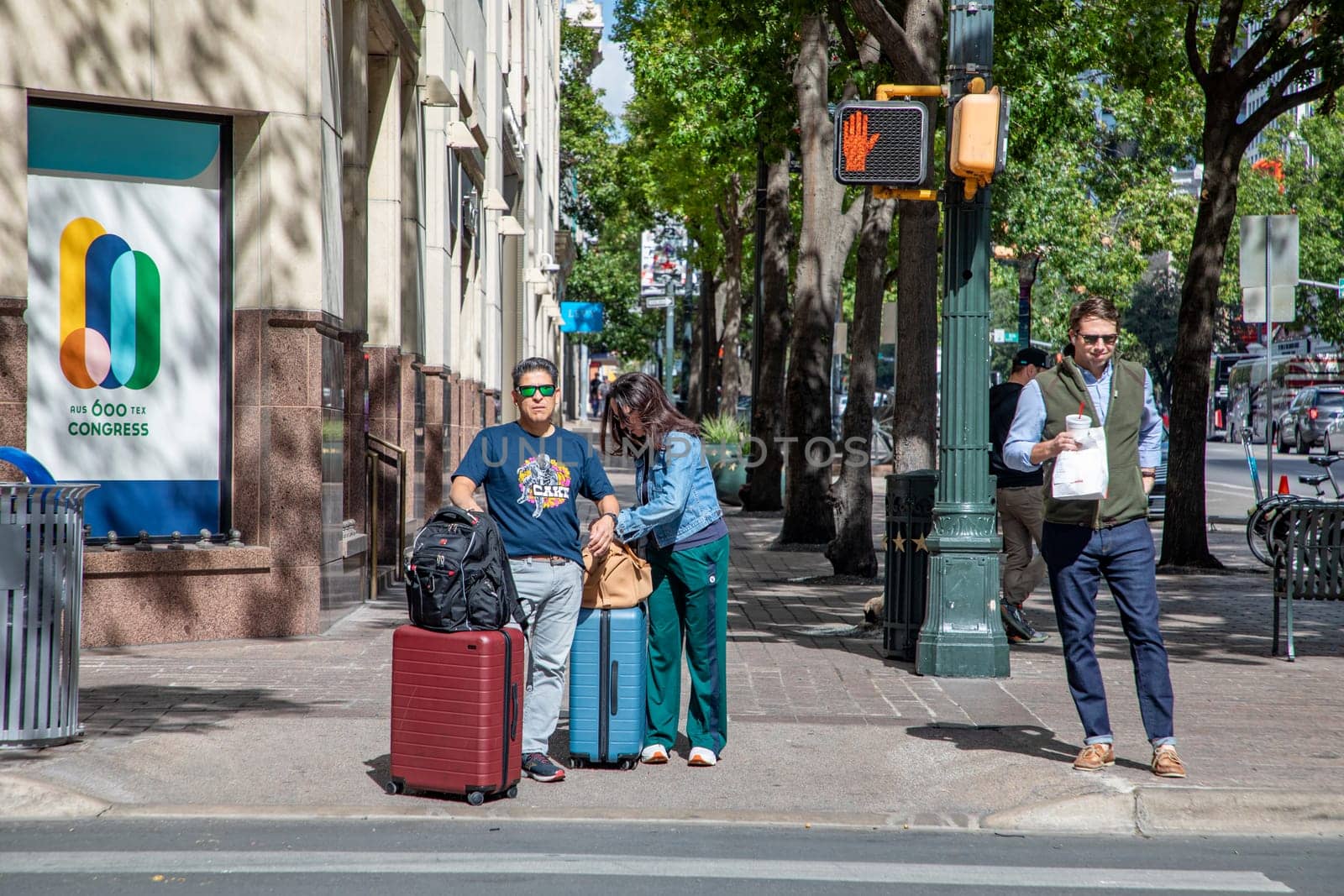 Austin, Texas - November 3, 2023:  people at a pedestrian crossing downtown Austin waiting for green light.
