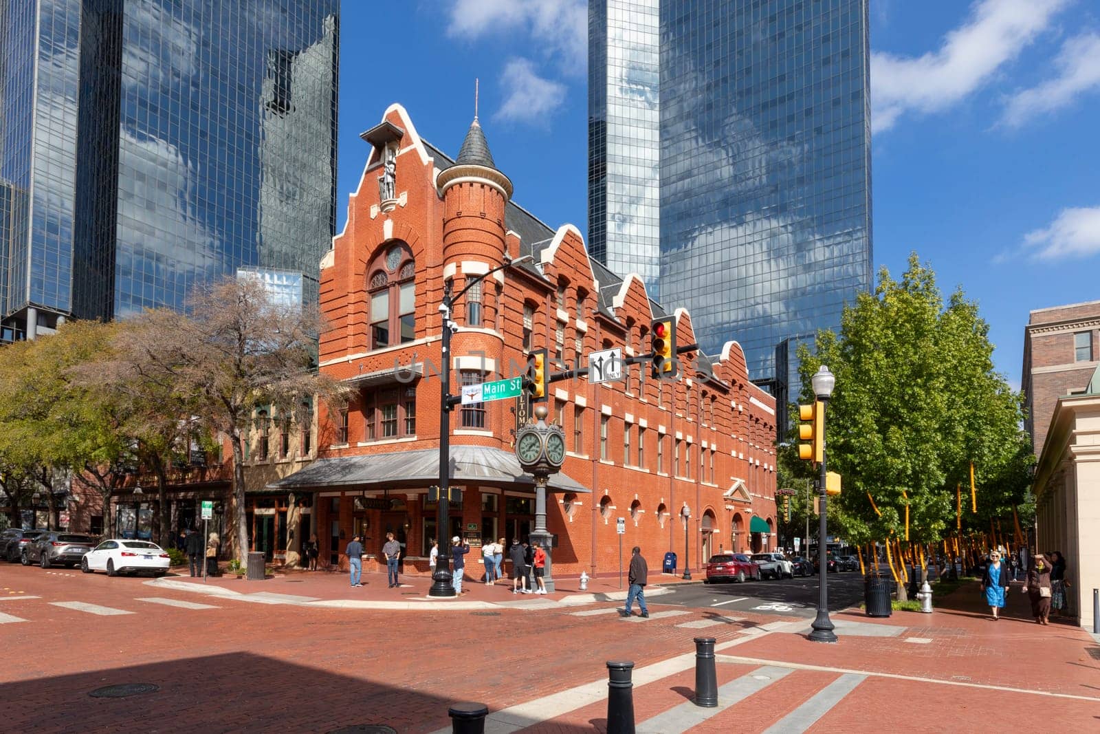 Fort Worth, Texas - November 4, 2023: Wells Fargo tower and historic bar and living house in Fort Worth at Main street.