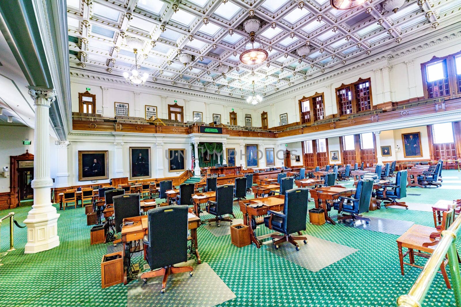 Austin, USA - November 2, 2023: Centered view down the wood desks and leather chairs in the senate, at the State Capitol building
