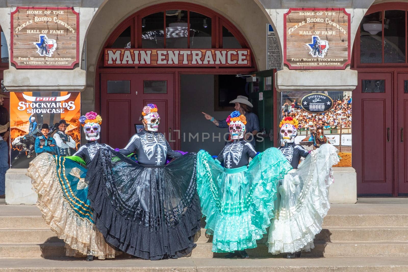 Fort Worth, Texas - November 5, 2023: mexican women pose for the day of the dead in western clothes at the stockyards in Fort Worth, Texas, USA..