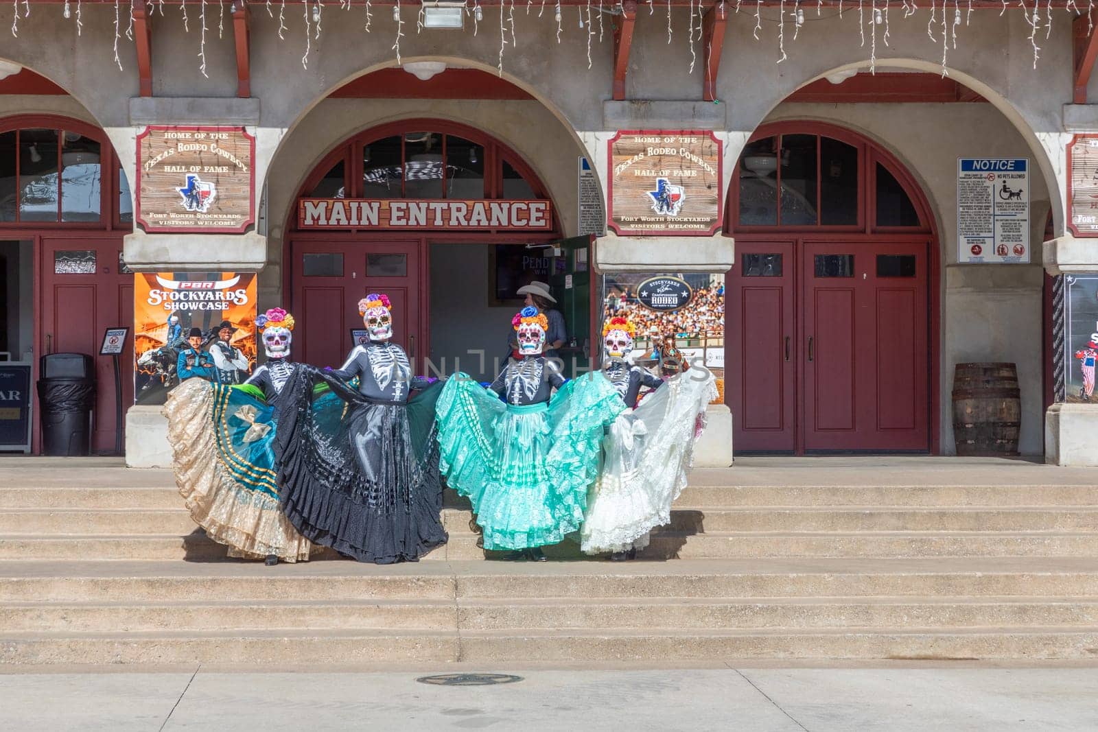 Fort Worth, Texas - November 5, 2023: mexican women pose for the day of the dead in western clothes at the stockyards in Fort Worth, Texas, USA..