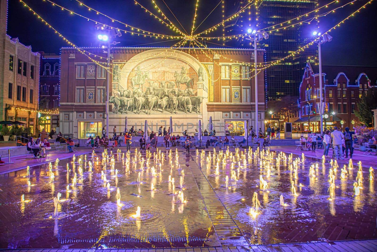 Fort Worth, Texas - November 5, 2023: people enjoy the illumination by night at sundance plaza in downtown Fort Worth.