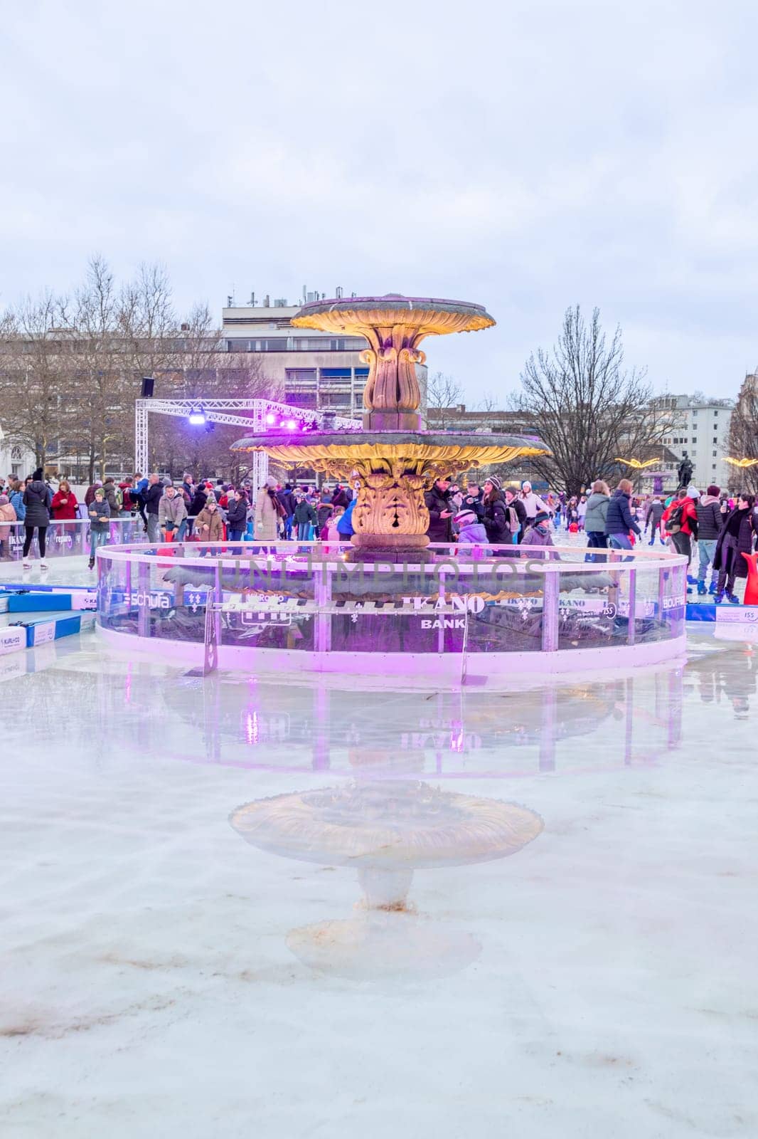 Wiesbaden, Germany - December 29, 2023: people enjoy the rink in front of the kurhaus in Wiesbaden, Hesse, germany.