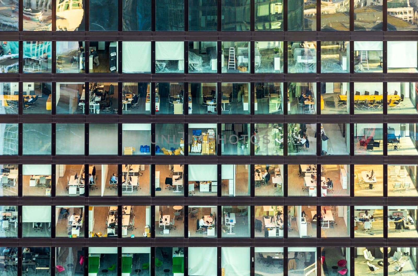 Frankfurt, Germany - February 1, 2024: facade view of an office building in Frankfurt with people working in the office.