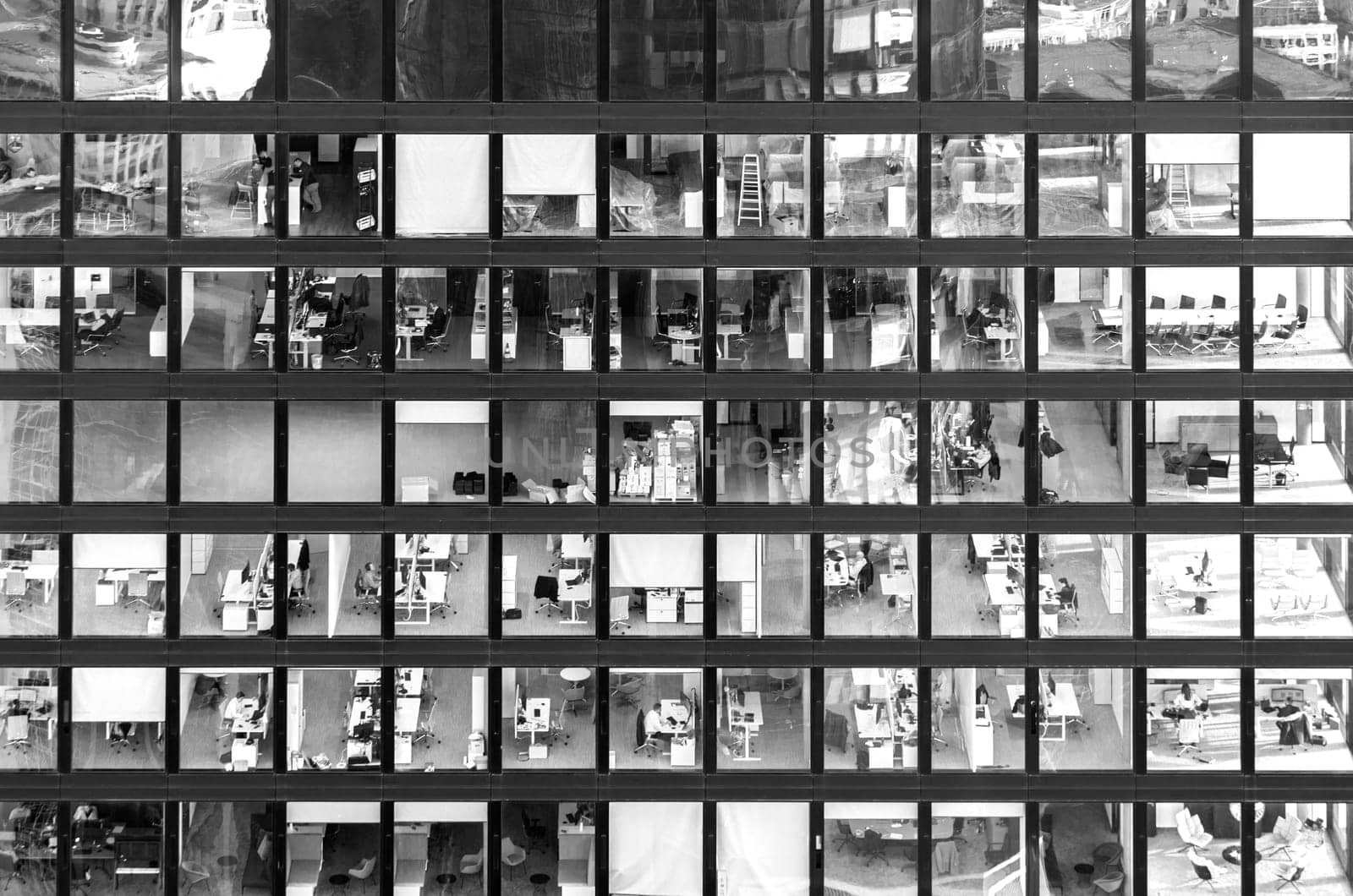 Frankfurt, Germany - February 1, 2024: facade view of an office building in Frankfurt with people working in the office.