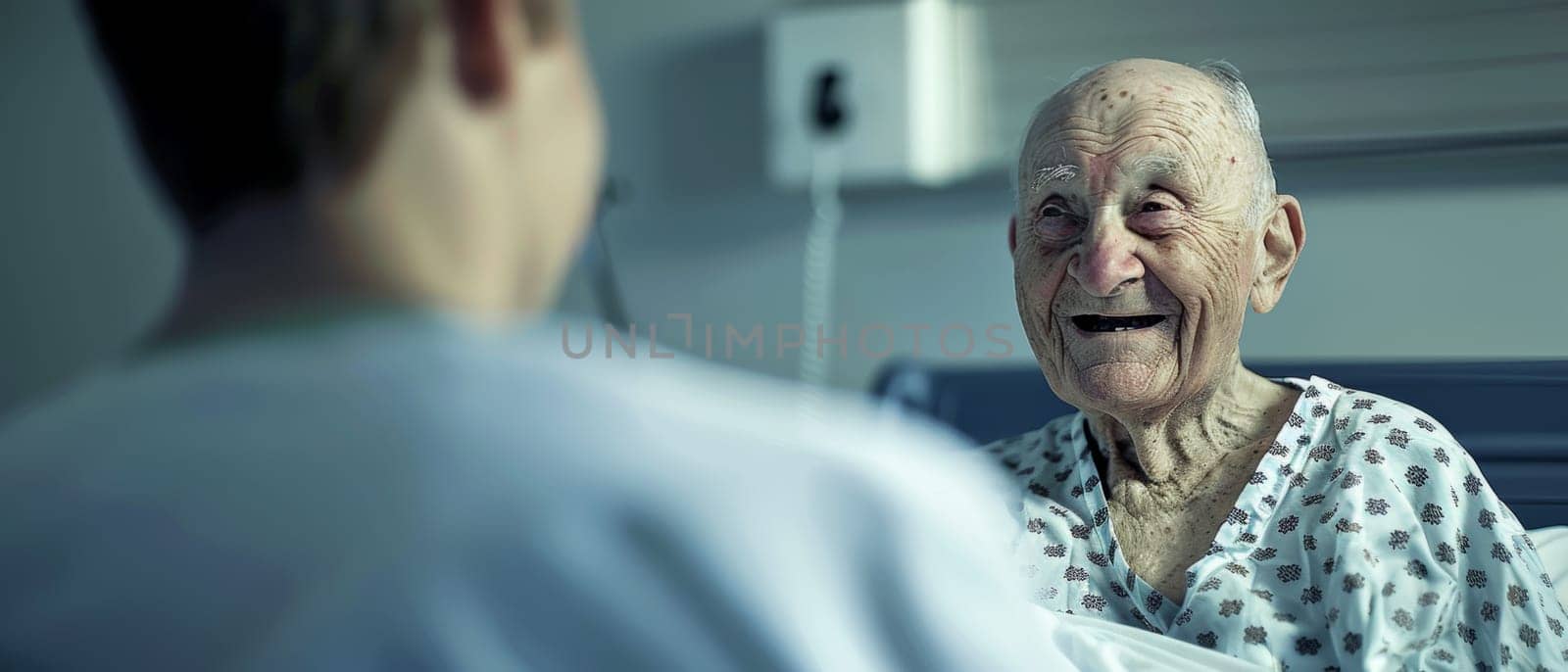 A close-up of an elderly man smiling during a lively conversation in a hospital room, his spirit undimmed by his surroundings