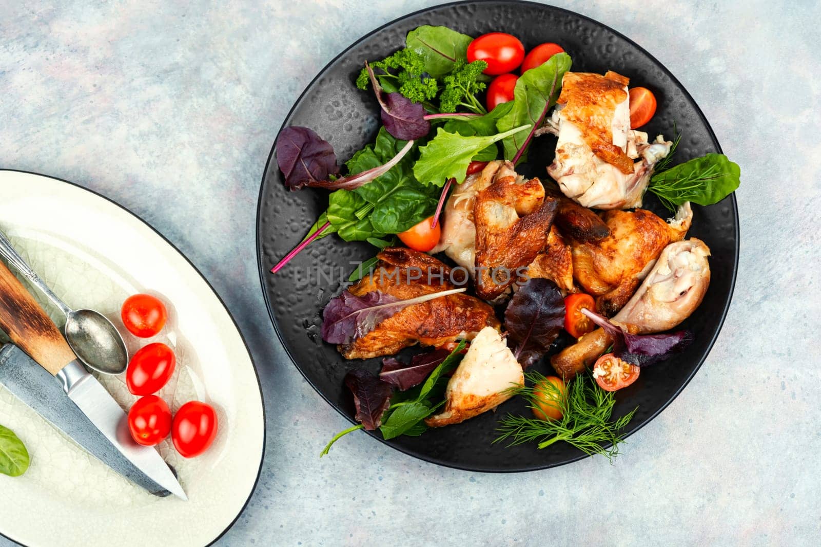 Sliced baked grilled chicken on a plate. Meat poultry.