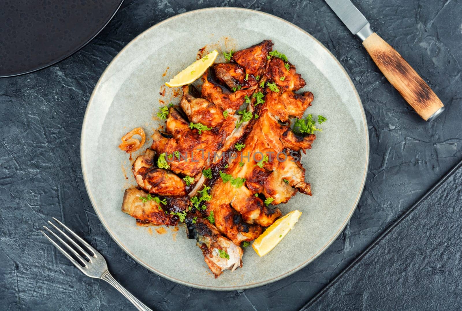 Baked cut mackerel fish in soy marinade. Top view. Copy space.