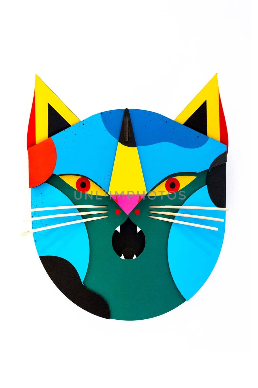 Colorful mask in the shape of a cat, on a white background.