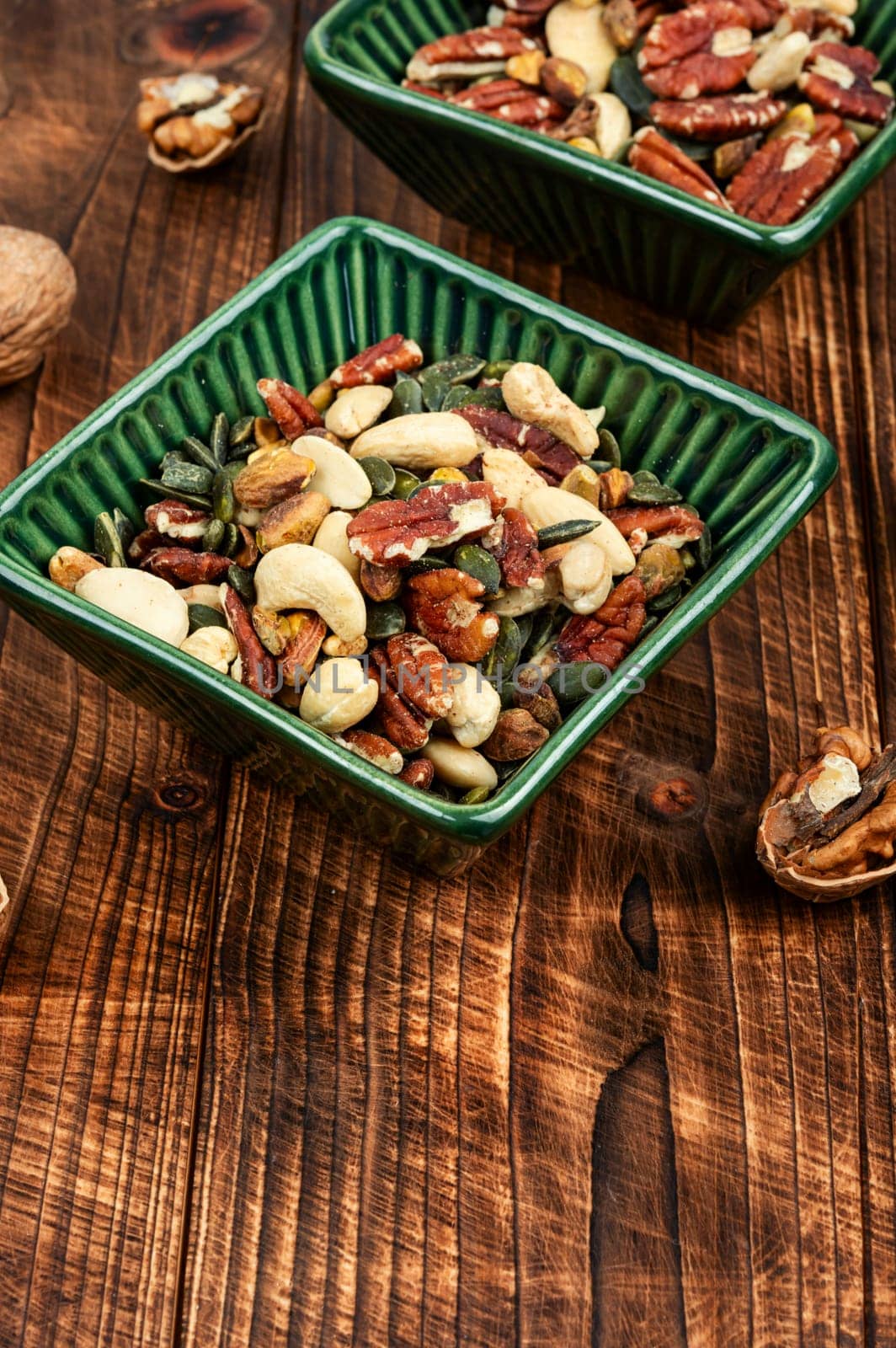 Mix of various nuts, pistachios, cashews, walnuts, peanuts and brazil nuts. Vegetarian food concept.