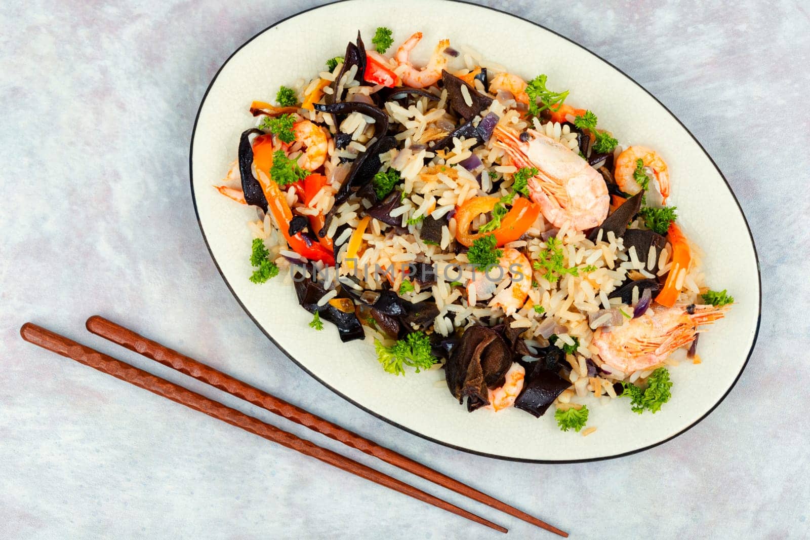 Shrimp fried rice serves on the dish. Thailand popular meal.
