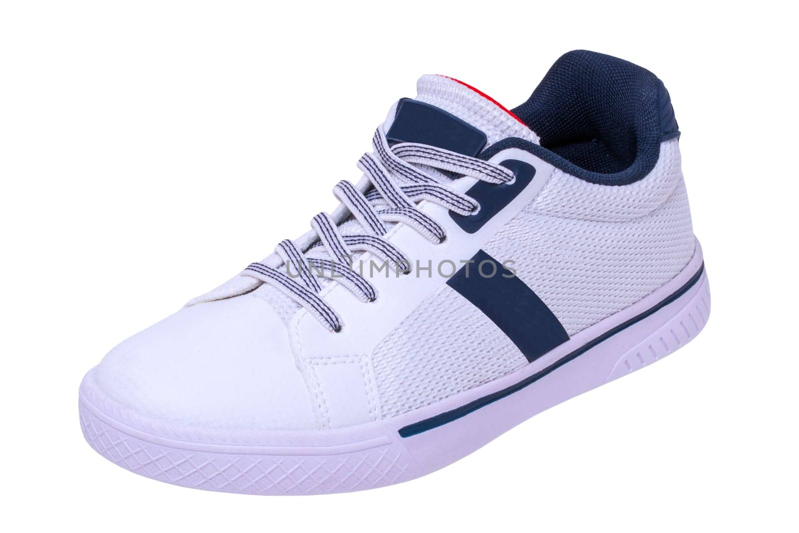 White sneakers isolated. Close-up of a single white elegant stylish leather sport shoe isolated on white background. Clipping path. Modern design footwear for workout. Macro.