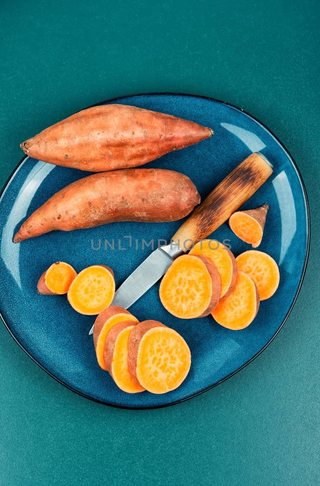 Sliced fresh sweet potatoes chunks for cooking. Orange kumara, yam. Healthy eating.
