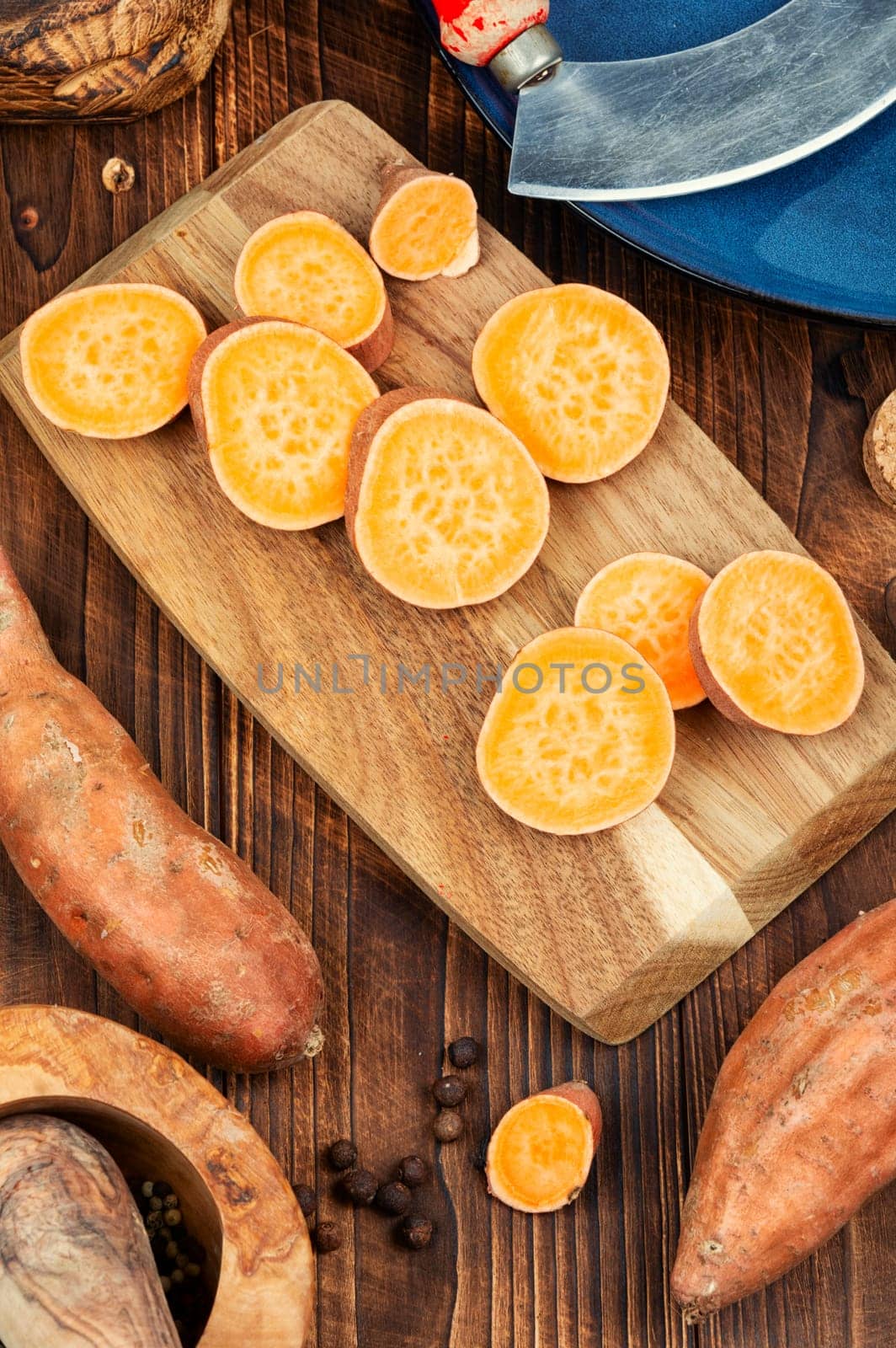 Sliced fresh sweet potatoes chunks for cooking. Orange kumara, yam. Healthy eating.