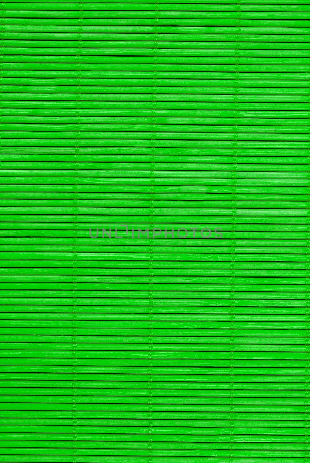 Green wooden vertical mat for hot food close-up view from above