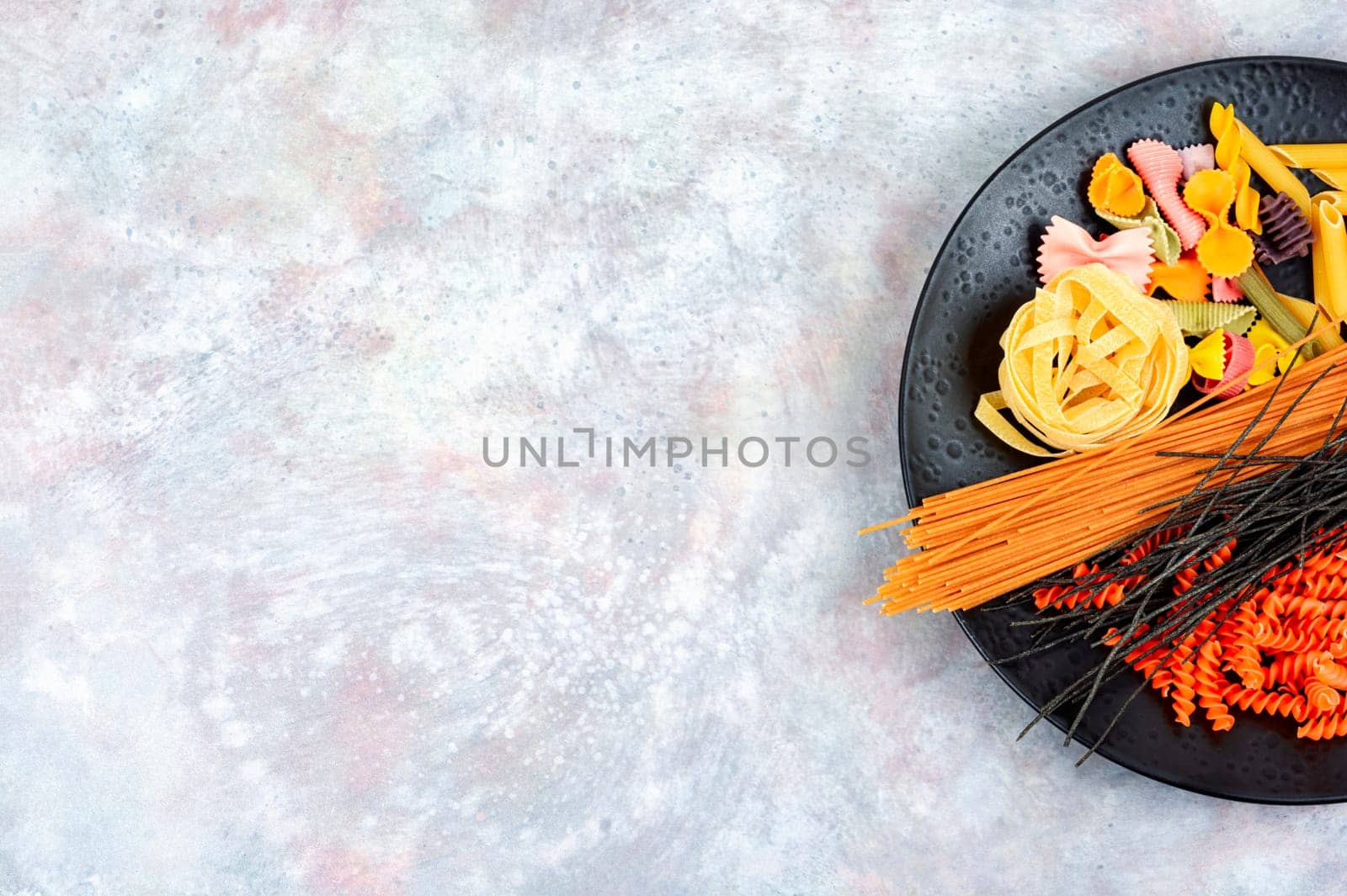 Different types and shapes of pasta, noodles, spaghetti. Top view, copy space