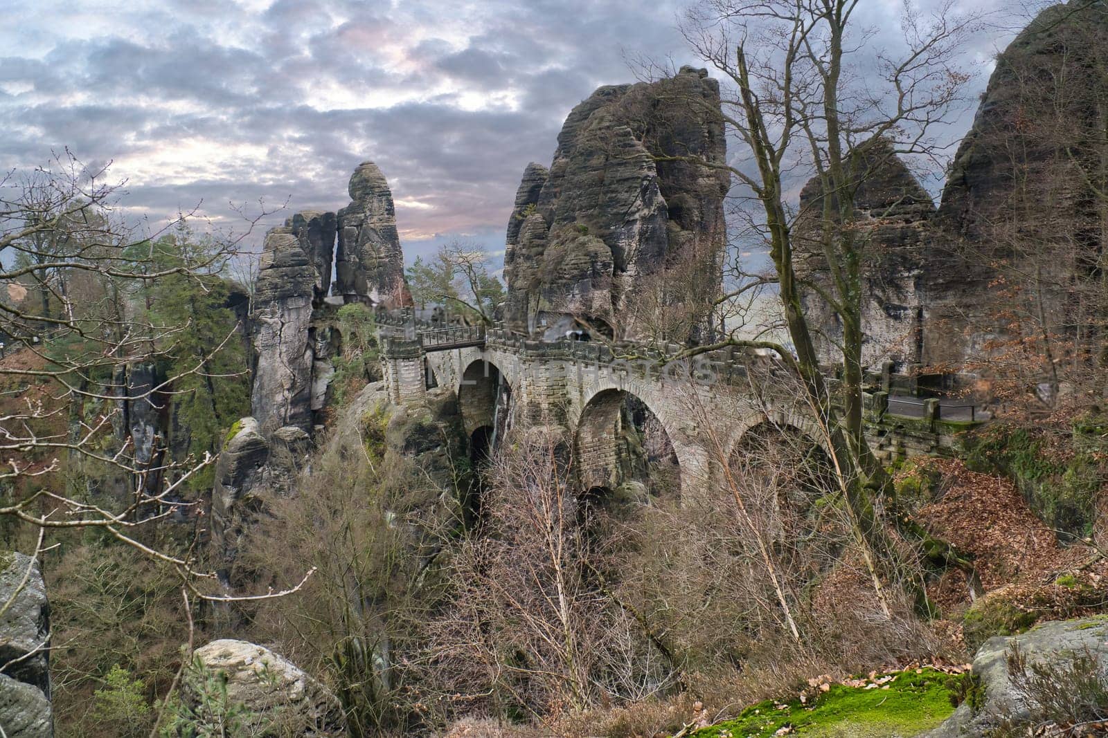The Bastei Bridge in Saxon Switzerland. jagged rocks, viewing platform overlooking the Elbe. Tourist attraction. Dramatic sky. National park in Germany