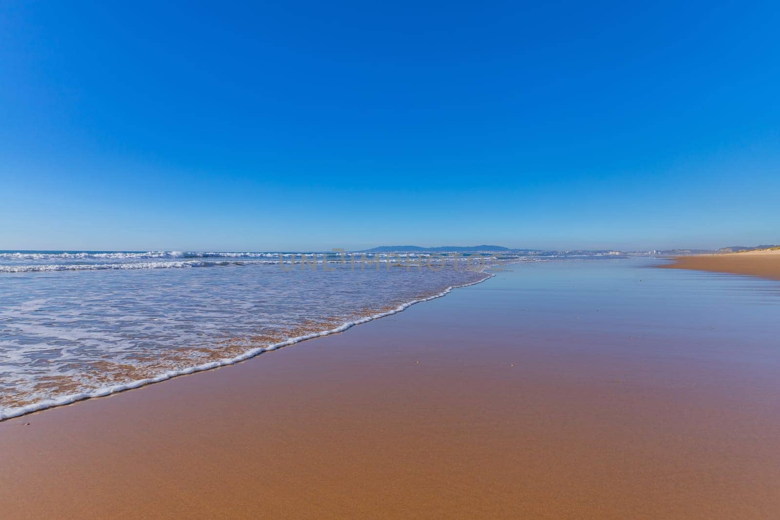 Atlantic Ocean at Costa da Caparica beach, near Lisbon in Portugal.