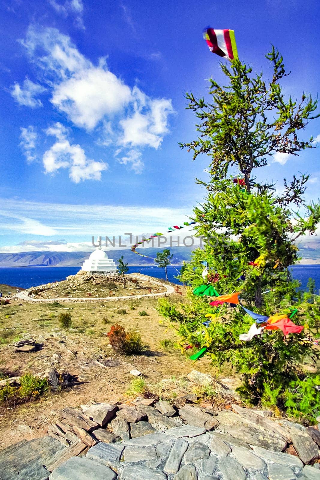 Colored ribbons on trees and pillars, superstition for good luck, Baikal traditions.