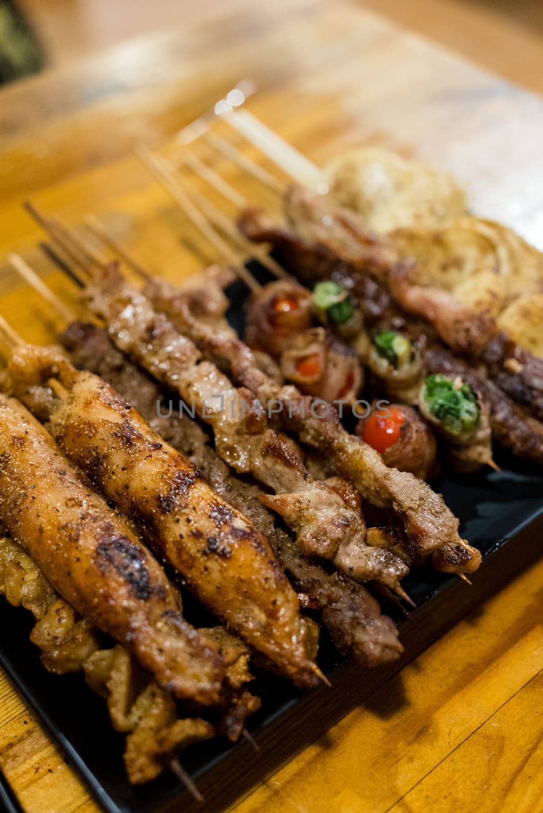 Variety of meat skewers on dish