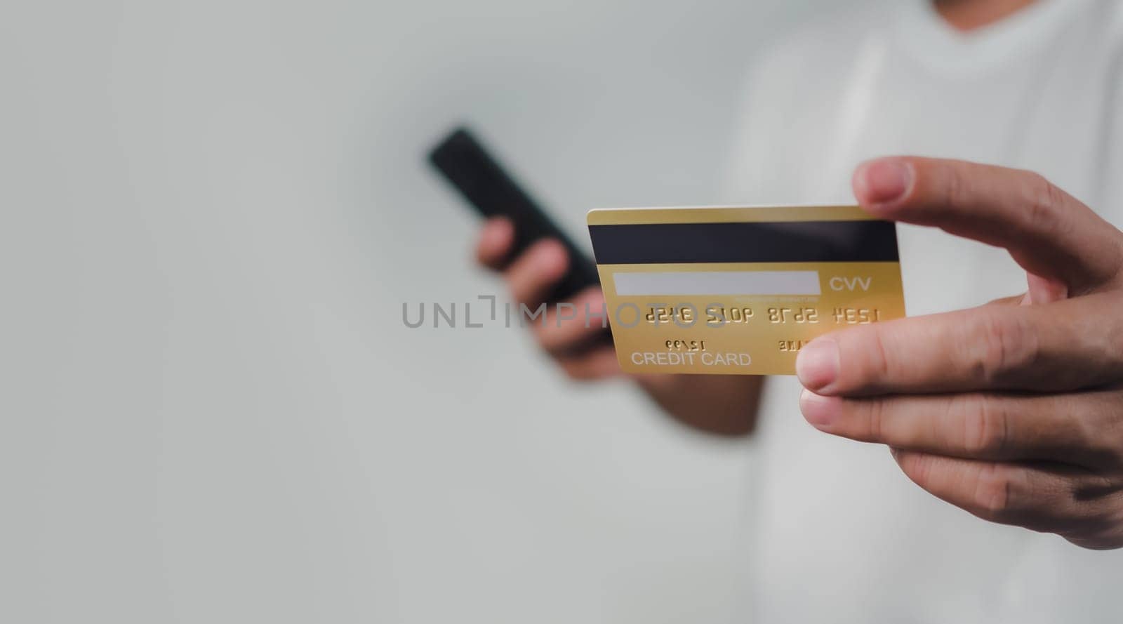Online payment, Man using mobile smartphone and credit card for online shopping, Digital online payment concept, Technology online banking applications via internet network, financial transaction.